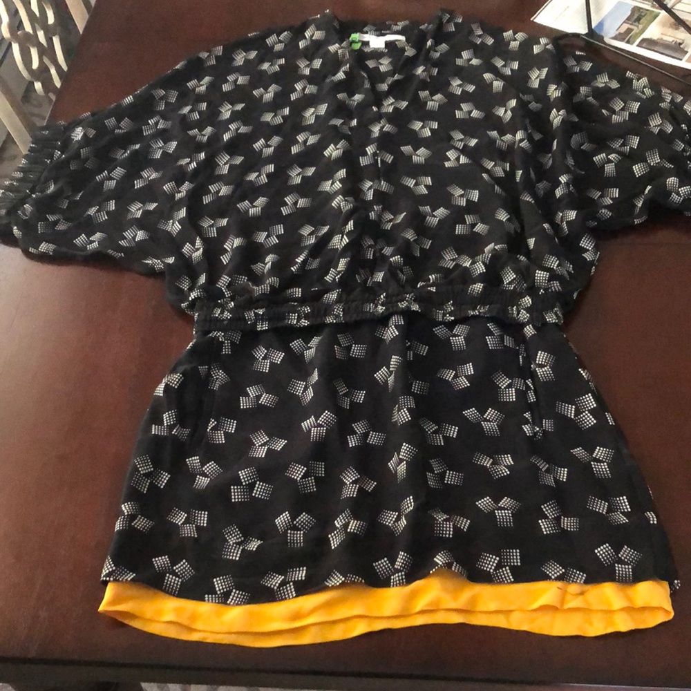 DVF blousy top and fitted mini patterned dress